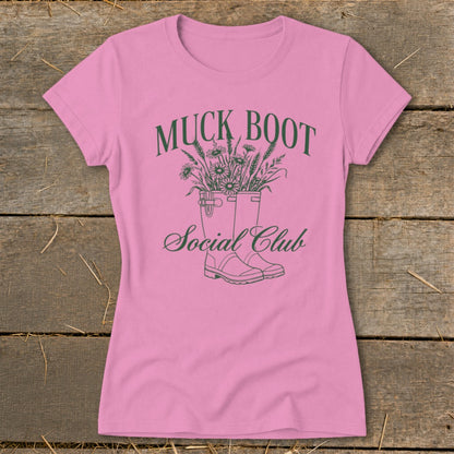 Pink t-shirt with Muck Boot Social Club graphic featuring boots with flowers.