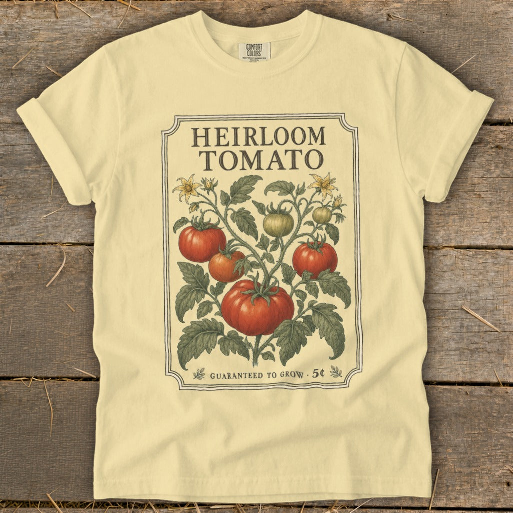 Light yellow t-shirt with "Heirloom Tomato" graphic and vintage botanical illustration.