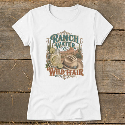 White t-shirt graphic with "Ranch Water & Wild Hair" text, desert scene, drink, and cowboy hat.