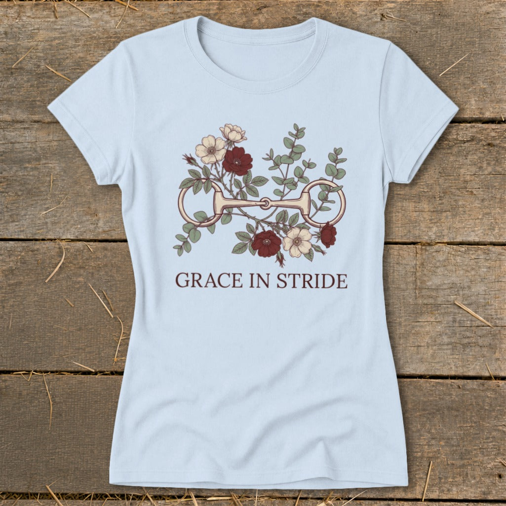 Light blue t-shirt with floral horse bit design and text "GRACE IN STRIDE".