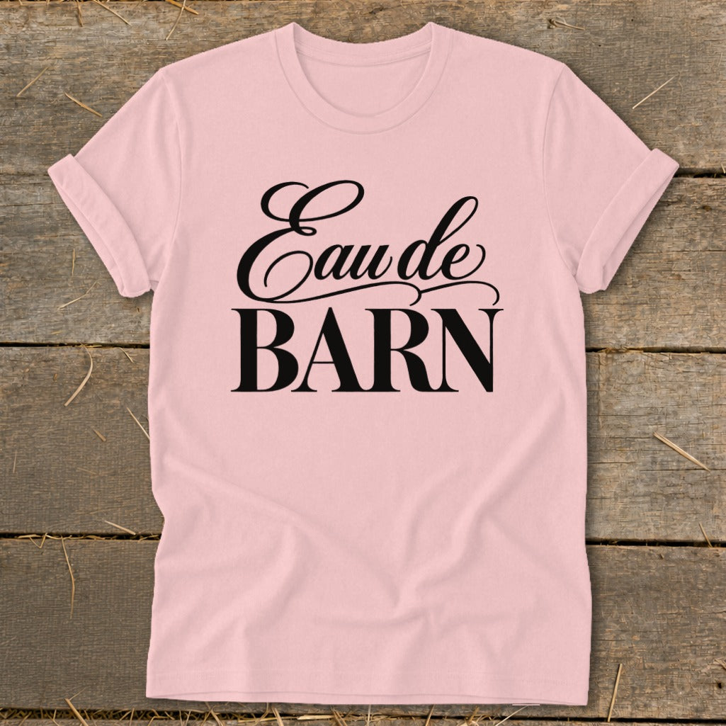 Pink t-shirt with black text reading "Eau de BARN".