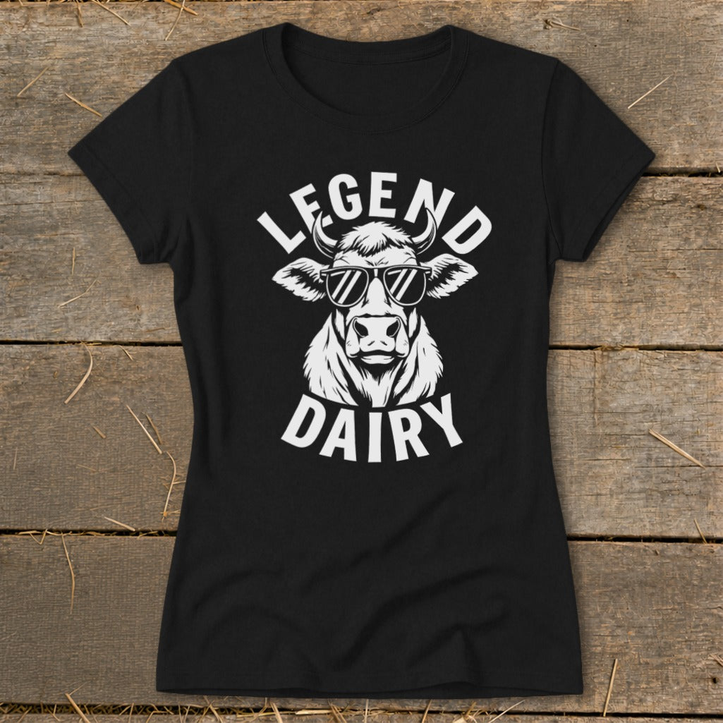 Black t-shirt with white graphic of a cow wearing sunglasses and text "LEGEND DAIRY".