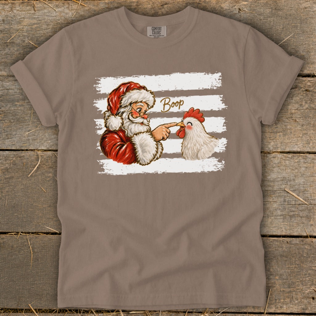 Santa boops a chicken's nose with the word "Boop" written above.