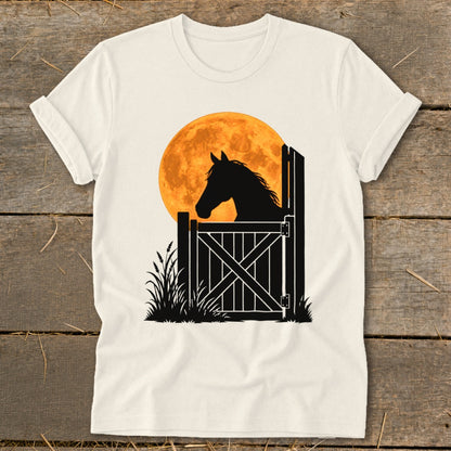 A white t-shirt featuring a graphic of a horse silhouetted against a large orange moon.