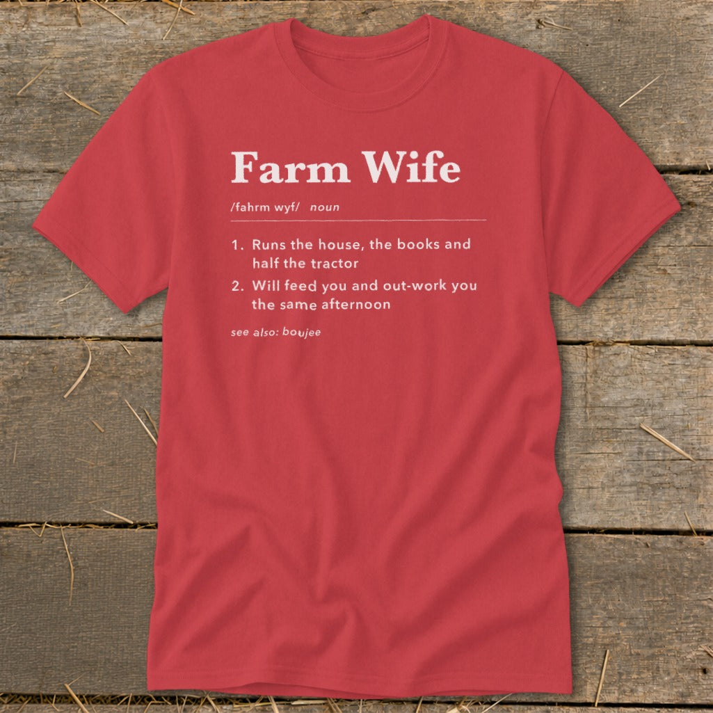 Red t-shirt with white text defining "Farm Wife" as running the house, books, tractor, and out-working.