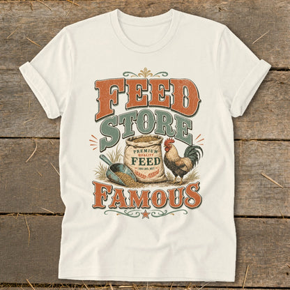 Cream t-shirt with "Feed Store Famous" text, sack of feed, chicken, and shovel.