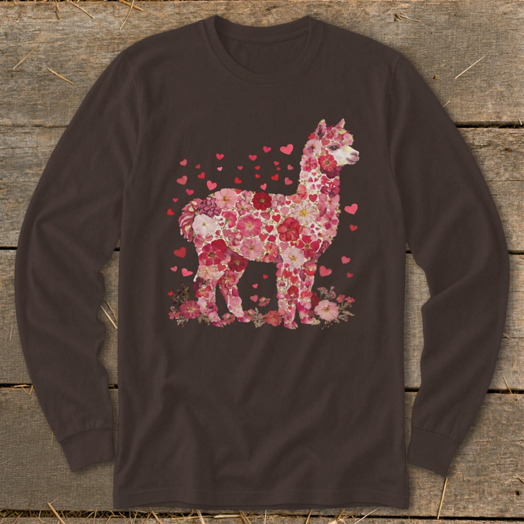 Alpaca formed from pink and red flowers and hearts on a dark brown long-sleeve shirt.