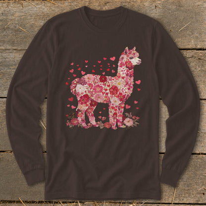 Alpaca formed from pink and red flowers and hearts on a dark brown long-sleeve shirt.