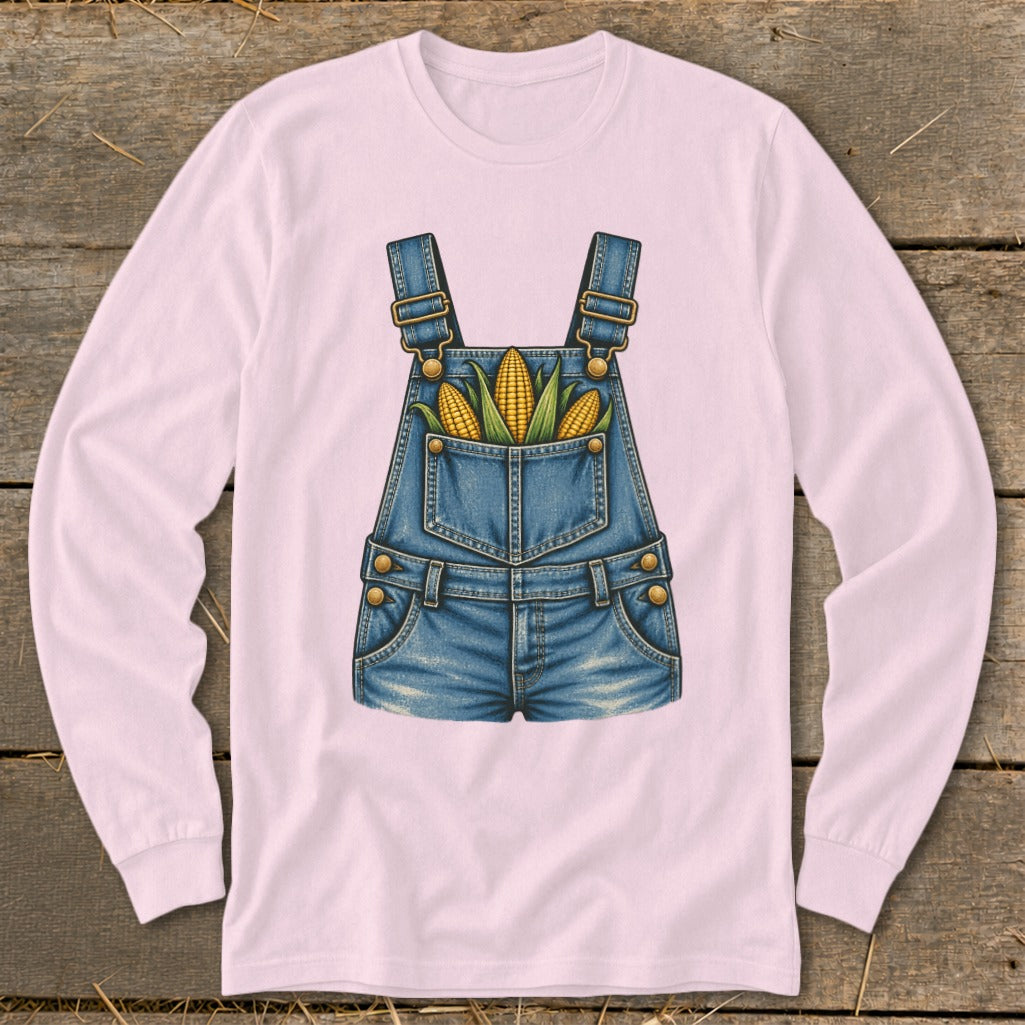 Pink long-sleeve shirt with a denim overalls graphic filled with corn.