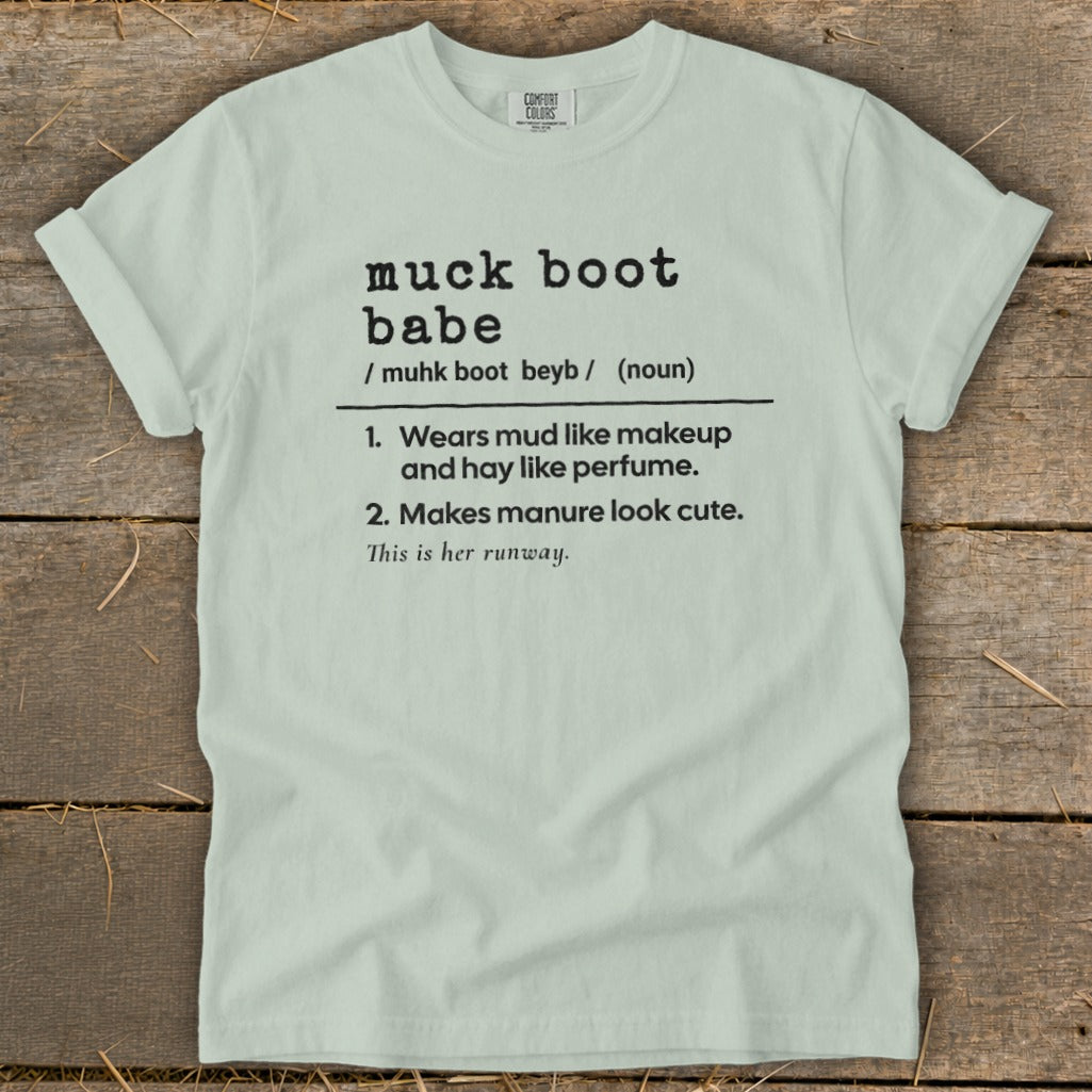 Light blue Comfort Colors t-shirt with "muck boot babe" definition.