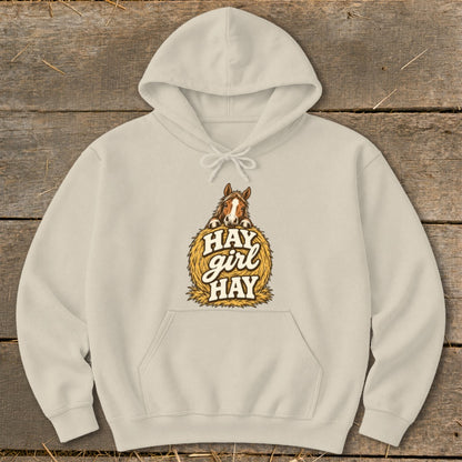 Cream hoodie with horse on hay bale graphic saying "Hay Girl Hay."