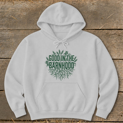 White hoodie with green text that reads "Good in the Barnhood" and a root graphic.
