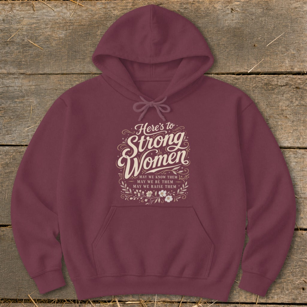 Maroon hoodie with "Here's to Strong Women" text and floral design.