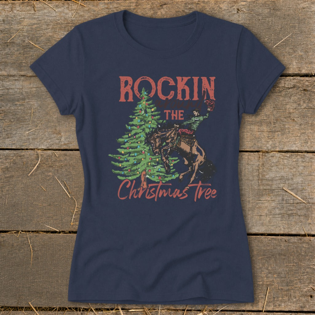 Navy t-shirt with "Rockin' the Christmas Tree" graphic of a rodeo rider on a bucking horse.
