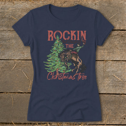 Navy t-shirt with "Rockin' the Christmas Tree" graphic of a rodeo rider on a bucking horse.