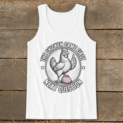 White tank top with chicken and egg graphic that reads "The Chicken Came First, Next Question."