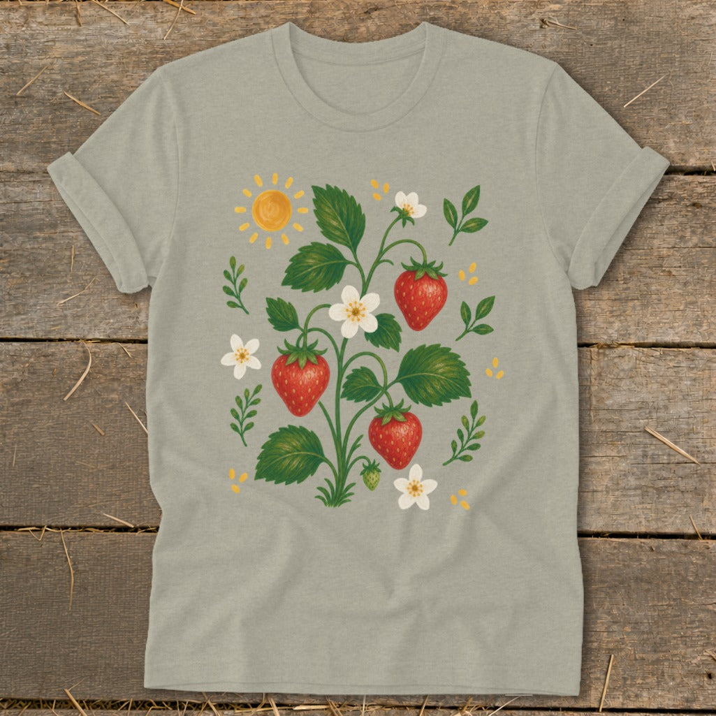 T-shirt with a whimsical strawberry plant illustration, sun, and flowers.