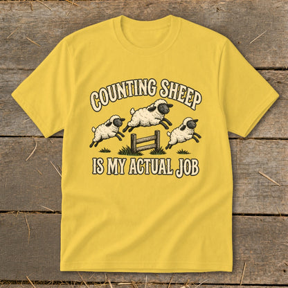 Yellow t-shirt with "Counting Sheep Is My Actual Job" and three jumping sheep graphic.