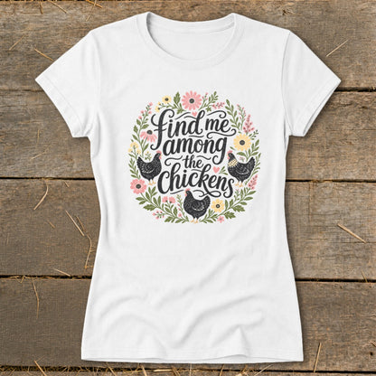 White t-shirt with a circular floral design featuring chickens and the text "find me among the chickens".