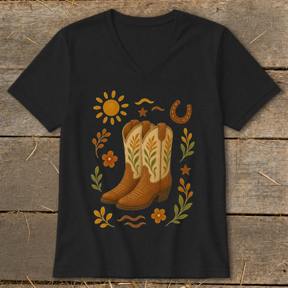 Black v-neck t-shirt with a western-themed graphic of cowboy boots, sun, horseshoe, and flowers.