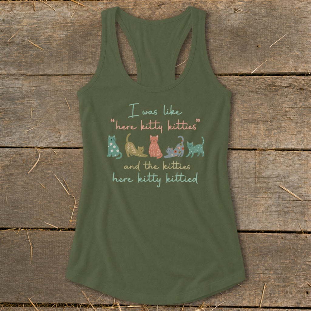 Olive green tank top with text and cartoon kittens.