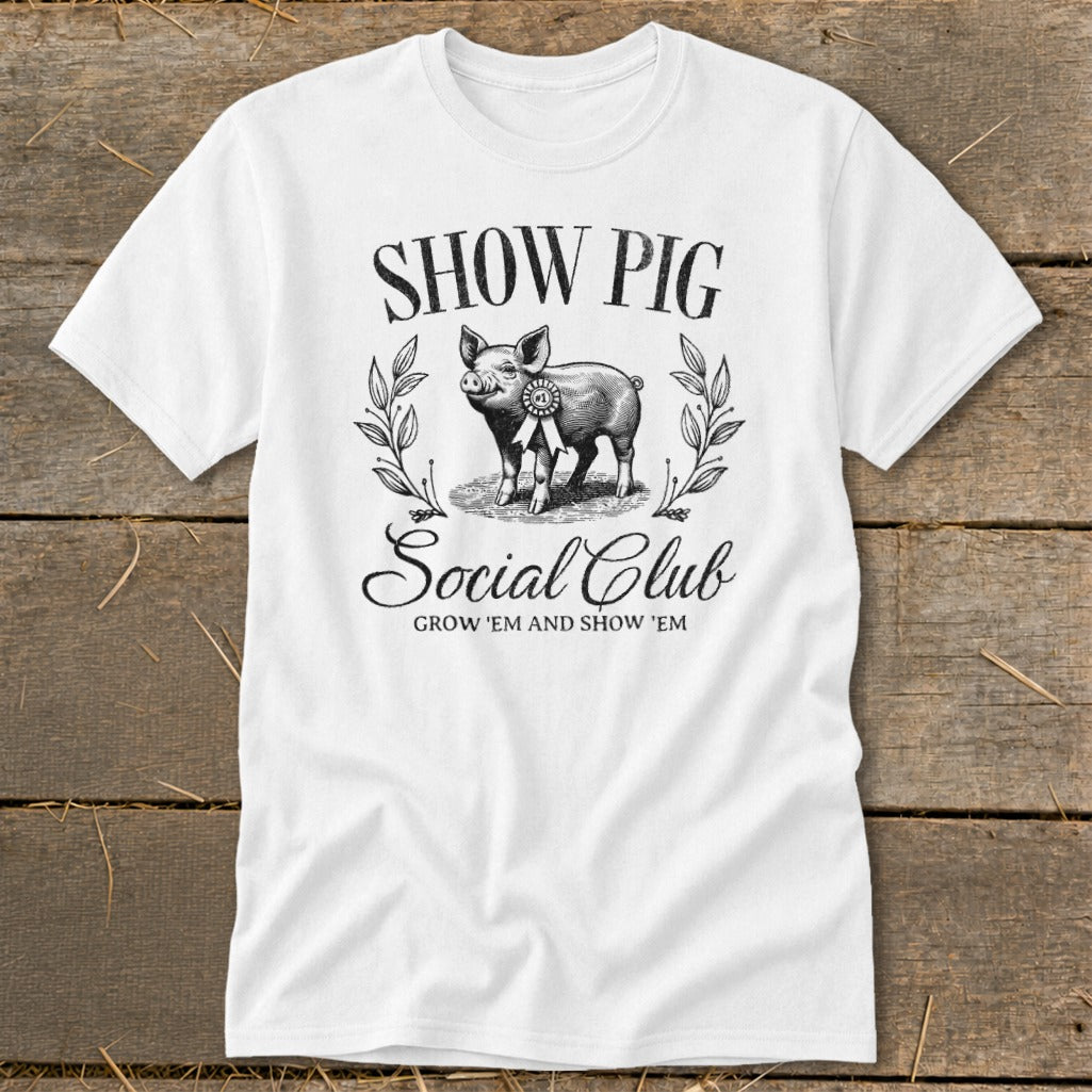 White t-shirt with a vintage illustration of a prize-winning pig and text.