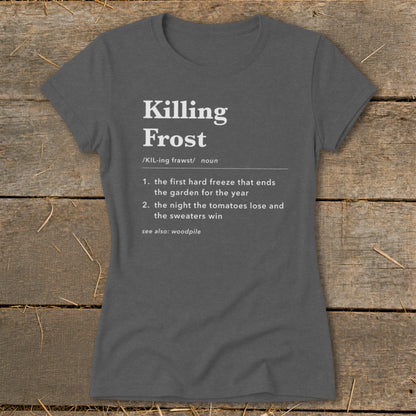 Dark gray women's t-shirt printed with a dictionary definition graphic for Killing Frost, displayed on a rustic wooden background.