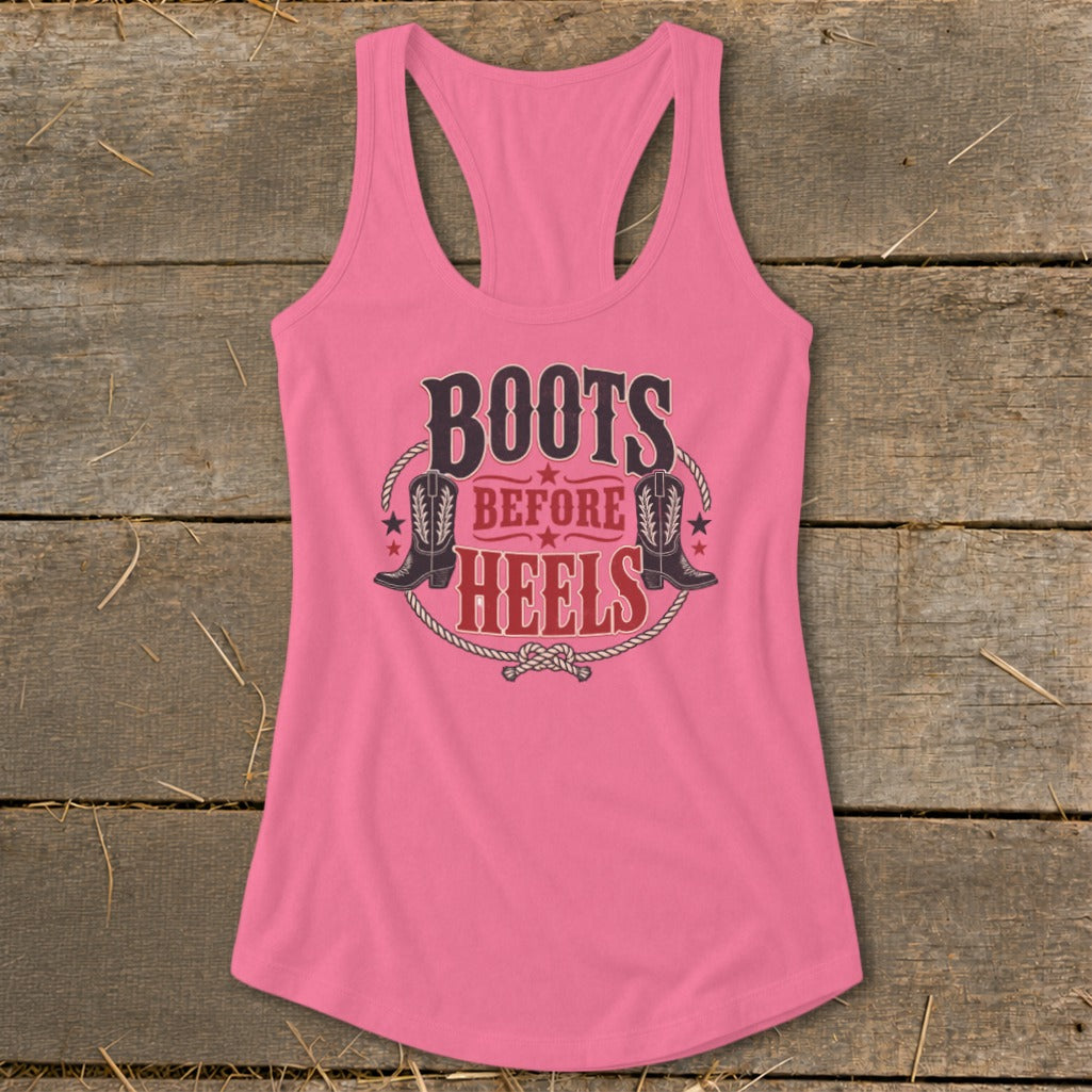 Pink racerback tank top with "Boots Before Heels" and cowboy boot graphic.