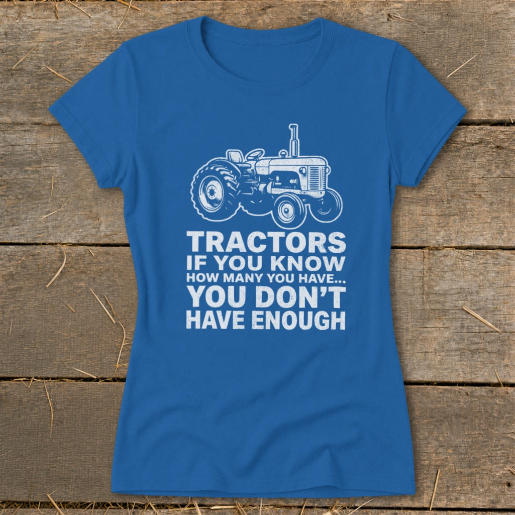 Blue t-shirt with white tractor graphic and text: "TRACTORS IF YOU KNOW HOW MANY YOU HAVE... YOU DON'T HAVE ENOUGH".