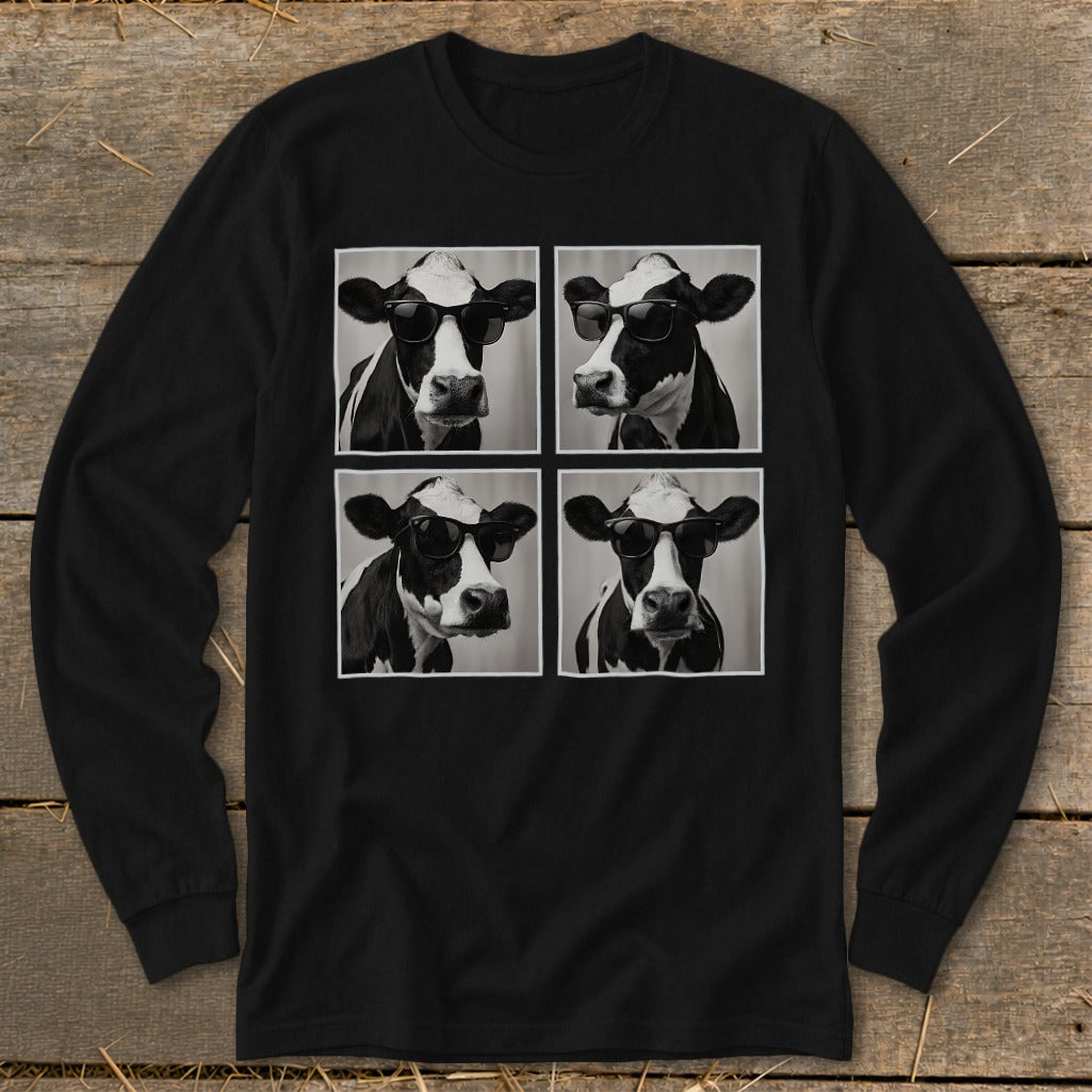 Four black and white cows wearing sunglasses in a grid on a black long-sleeve shirt.
