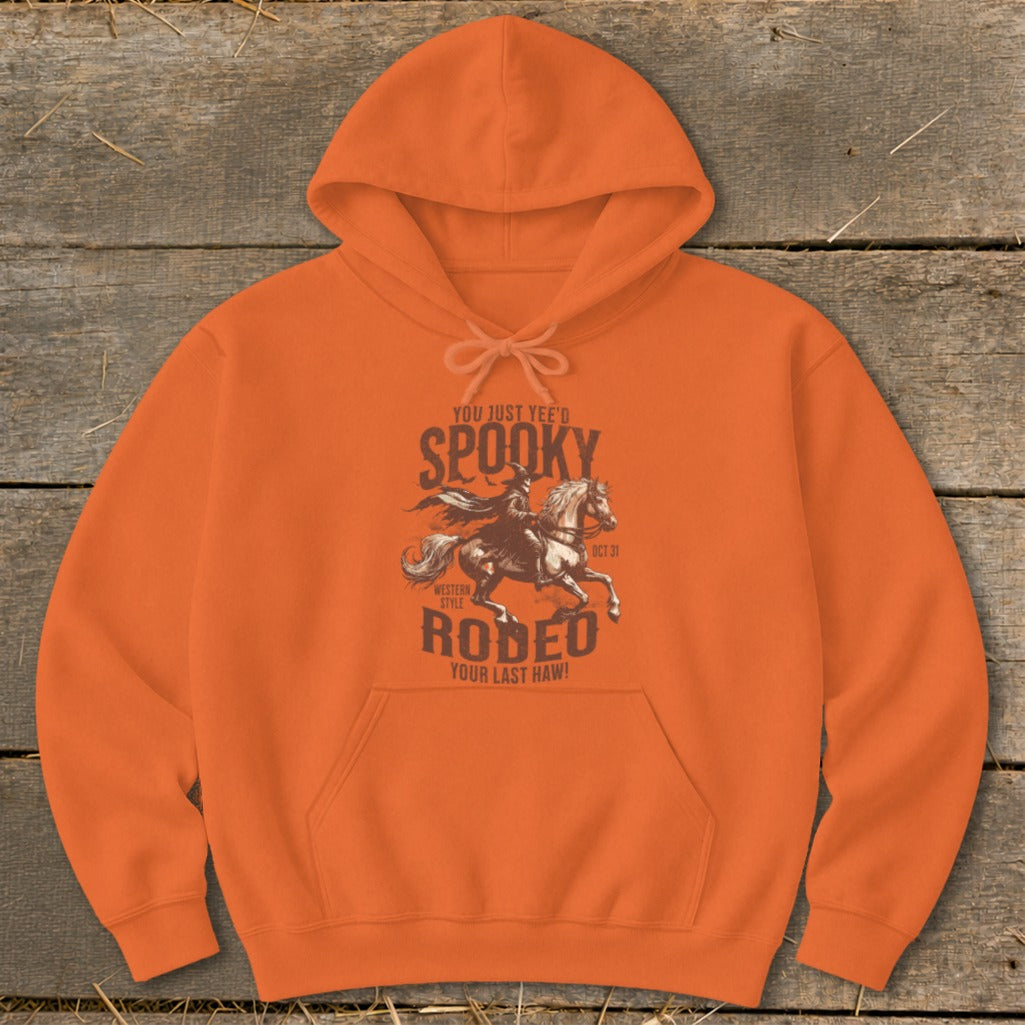 Orange hoodie with a spooky western rodeo graphic and text.