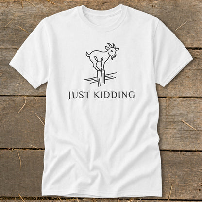 White t-shirt with a line drawing of a goat on a fence post and "JUST KIDDING" text.