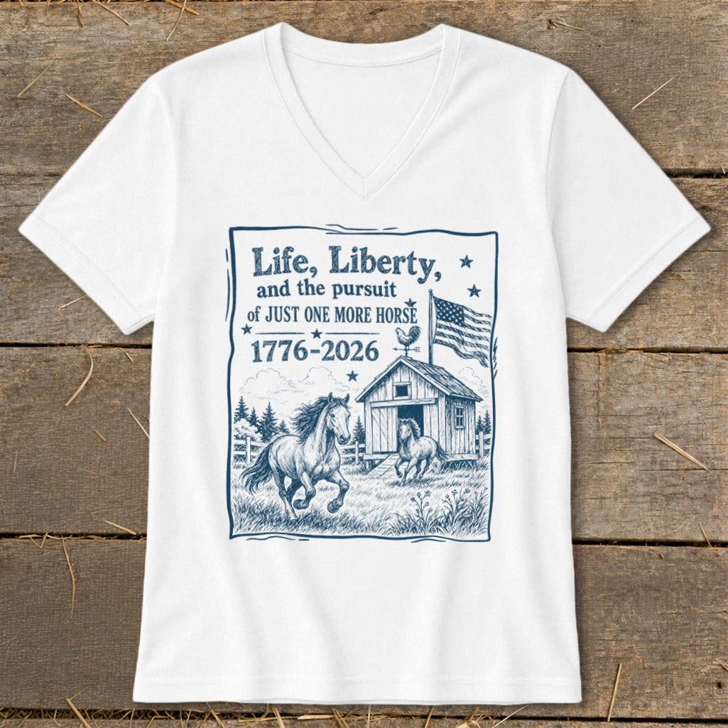 White t-shirt with dark blue graphic: "Life, Liberty, and the pursuit of JUST ONE MORE HORSE 1776-2026".