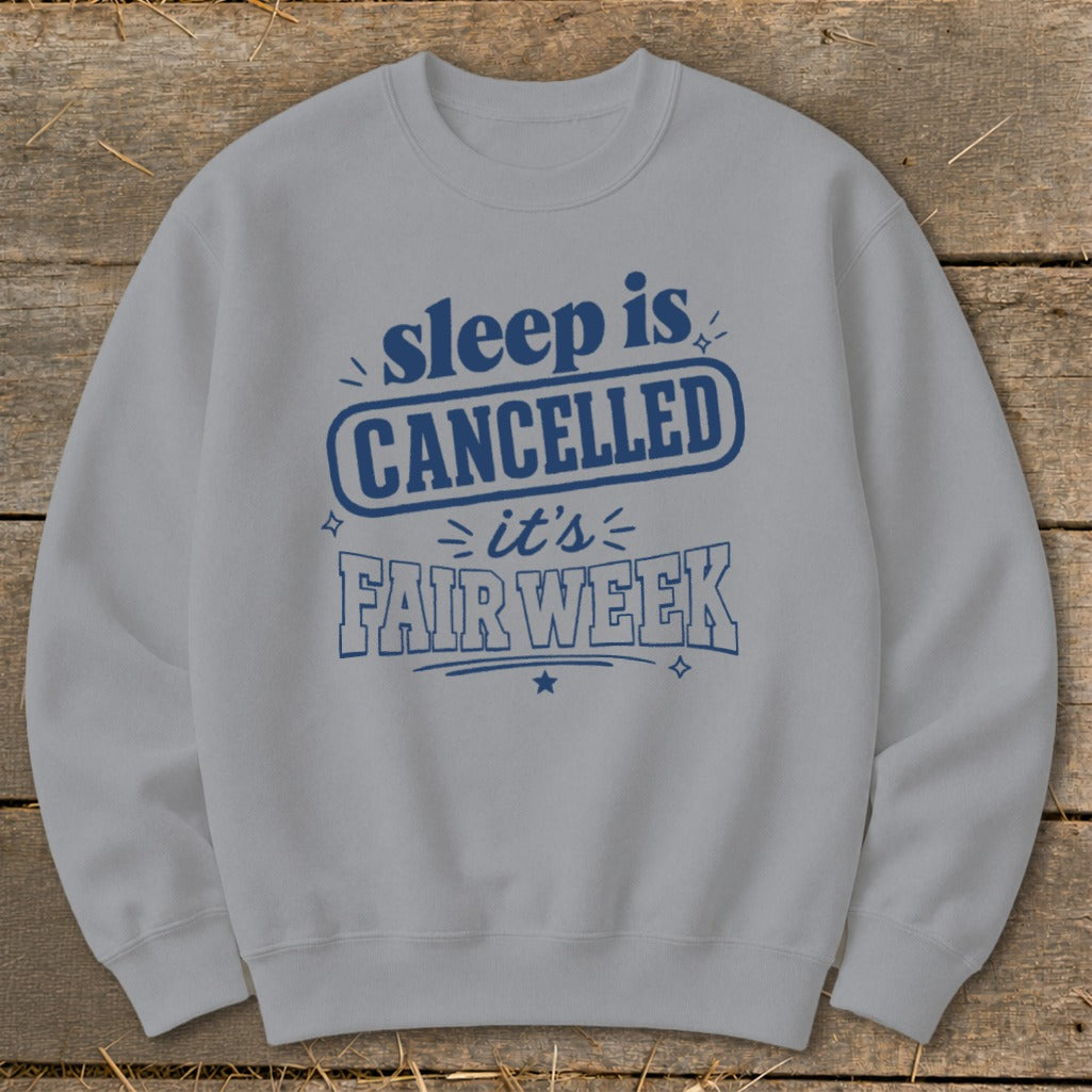 Light grey sweatshirt with blue text: "sleep is CANCELLED it's FAIR WEEK"