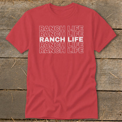 Red crewneck t-shirt featuring the stacked white text Ranch Life laid out against a rustic wooden background.