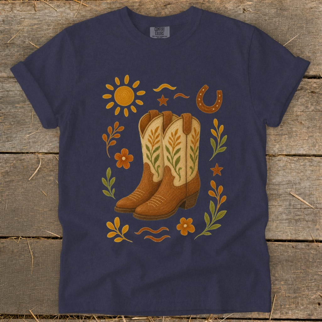 Navy t-shirt with western cowboy boots, sun, horseshoe, and floral graphic.