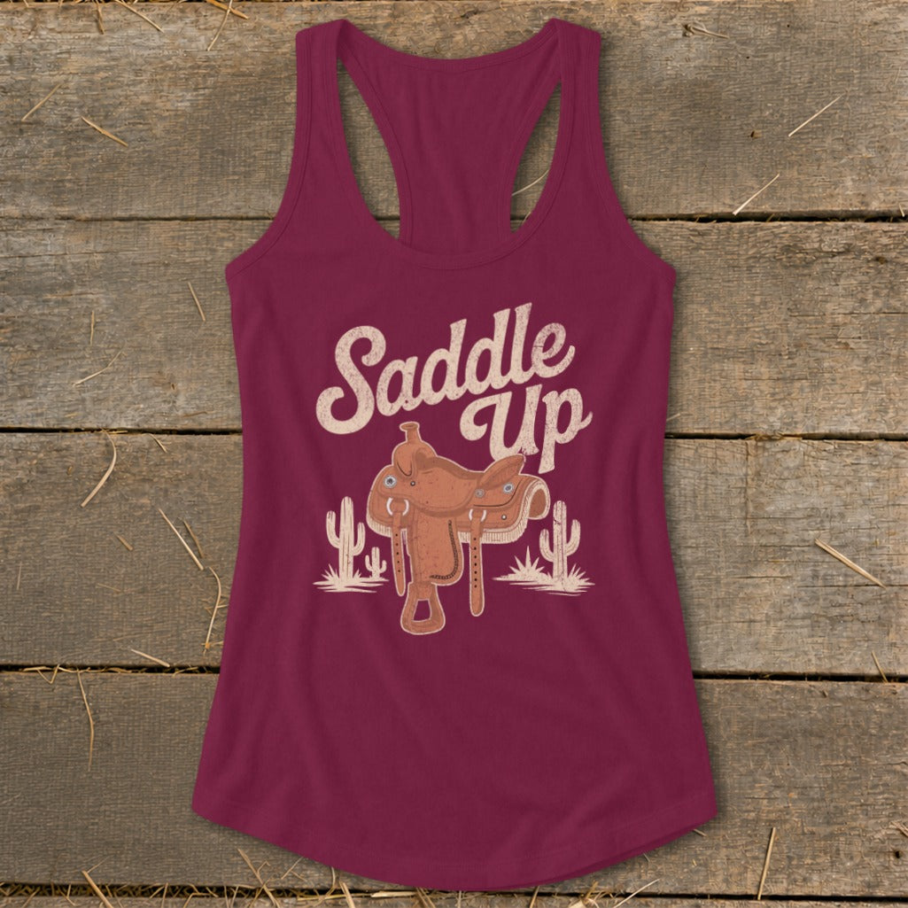 Burgundy tank top with "Saddle Up" text and a western saddle graphic.