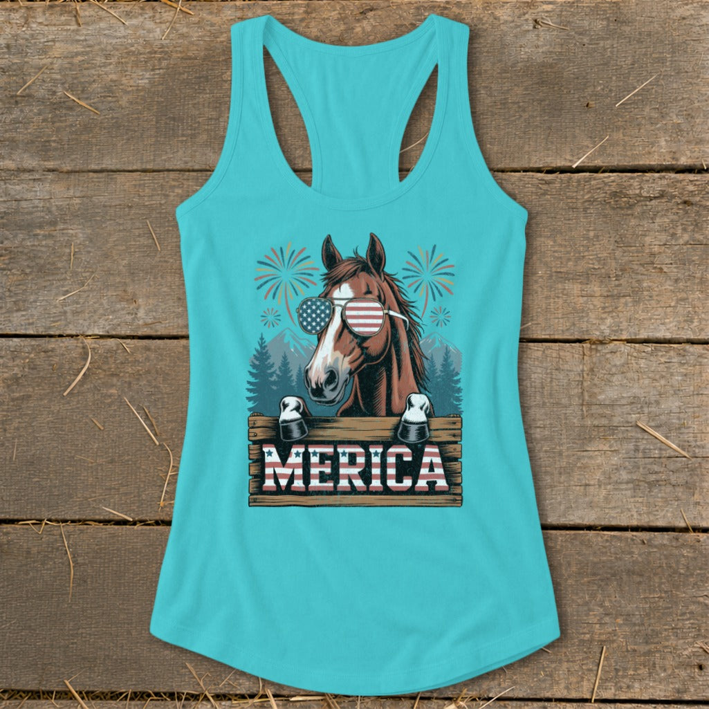 Brown horse wearing American flag sunglasses and "Merica" sign with fireworks.