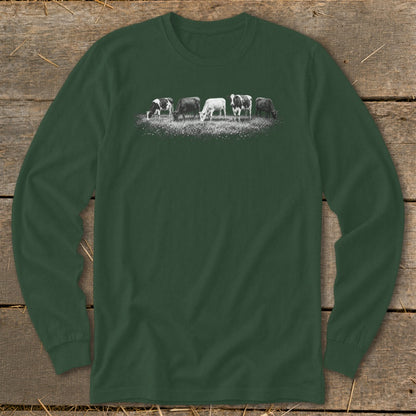 Long-sleeve dark green shirt with a line of cows grazing on a grassy field graphic.