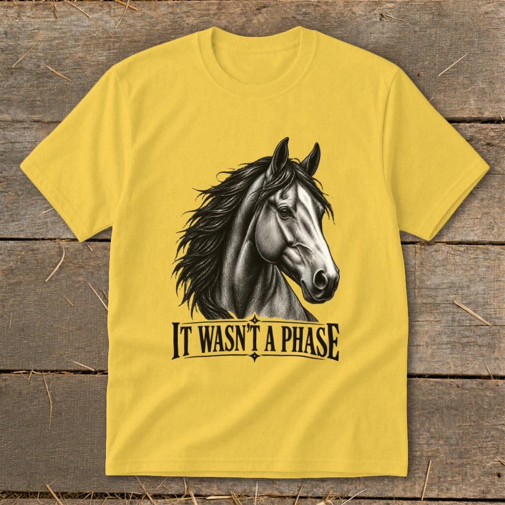 Yellow t-shirt with a black and white horse graphic and text "IT WASN'T A PHASE".