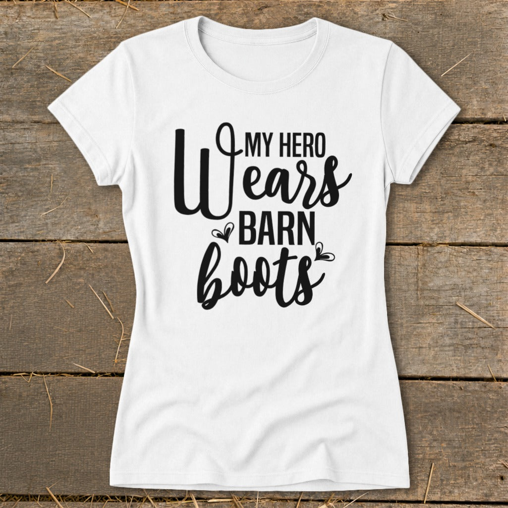 White t-shirt with black text that reads "My Hero Wears Barn Boots".
