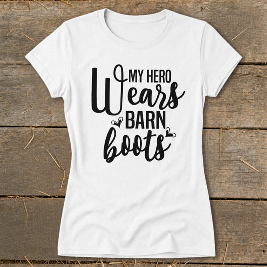 White t-shirt with black text that reads "My Hero Wears Barn Boots".