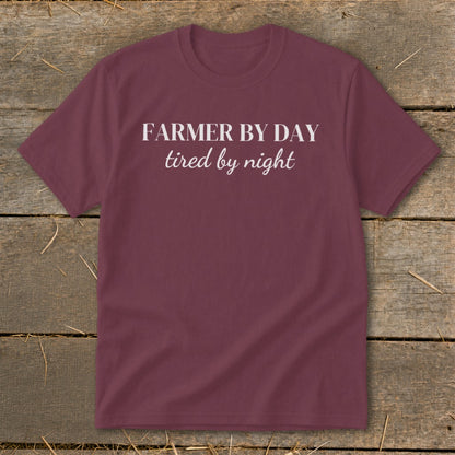Maroon t-shirt with white text reading "FARMER BY DAY tired by night".