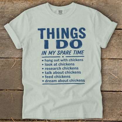 Light blue t-shirt with "THINGS I DO IN MY SPARE TIME" and a chicken-themed list.