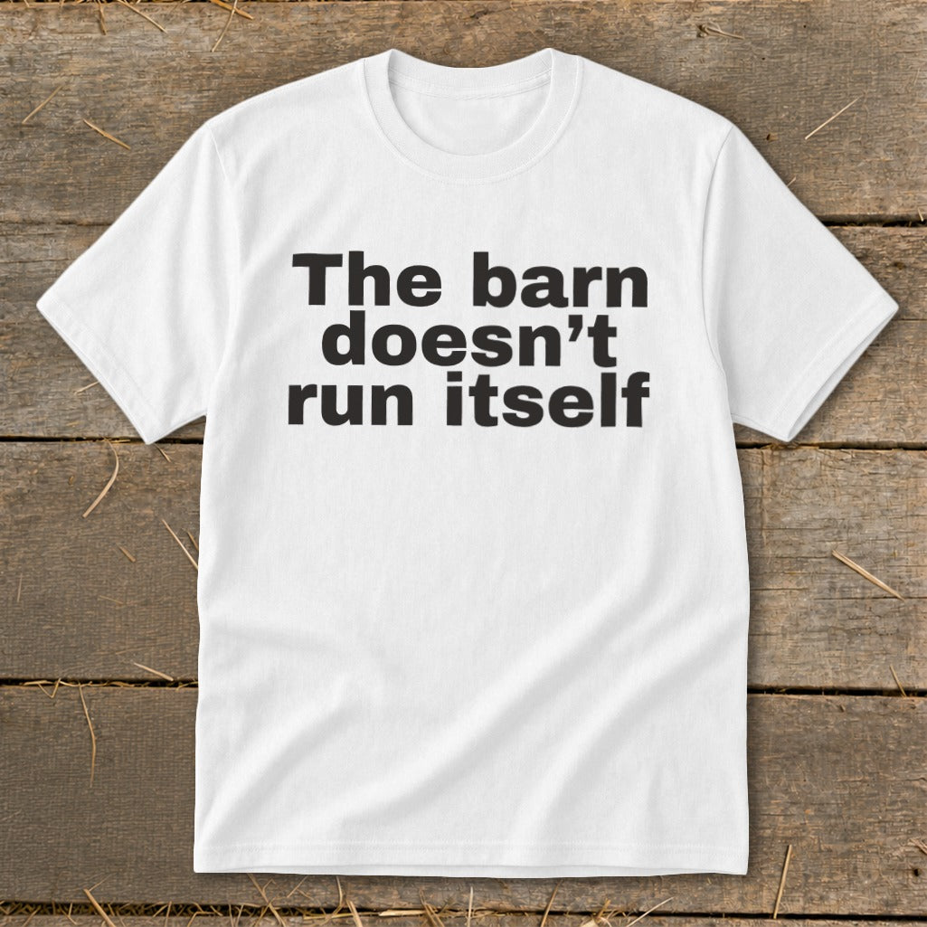 White t-shirt with black text reading "The barn doesn't run itself".