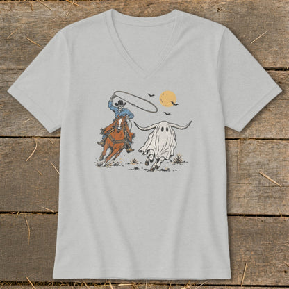Skeleton cowboy on horse lassoing a ghost with long horns under a moon.