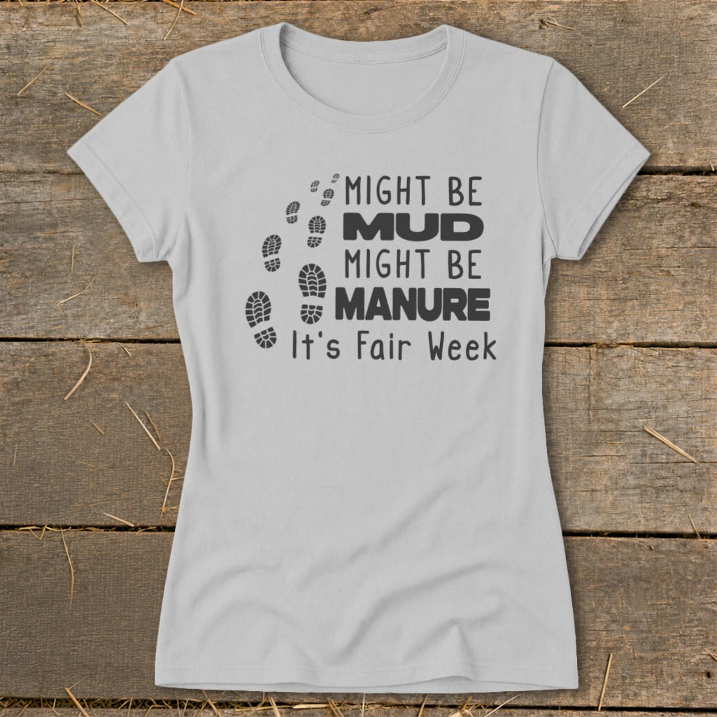 Light grey t-shirt with black text and footprints: "Might be Mud, Might be Manure. It's Fair Week."