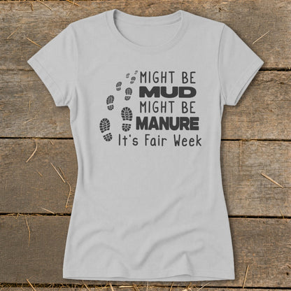 Light grey t-shirt with black text and footprints: "Might be Mud, Might be Manure. It's Fair Week."