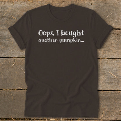 Dark brown t-shirt with white text: "Oops, I bought another pumpkin..."