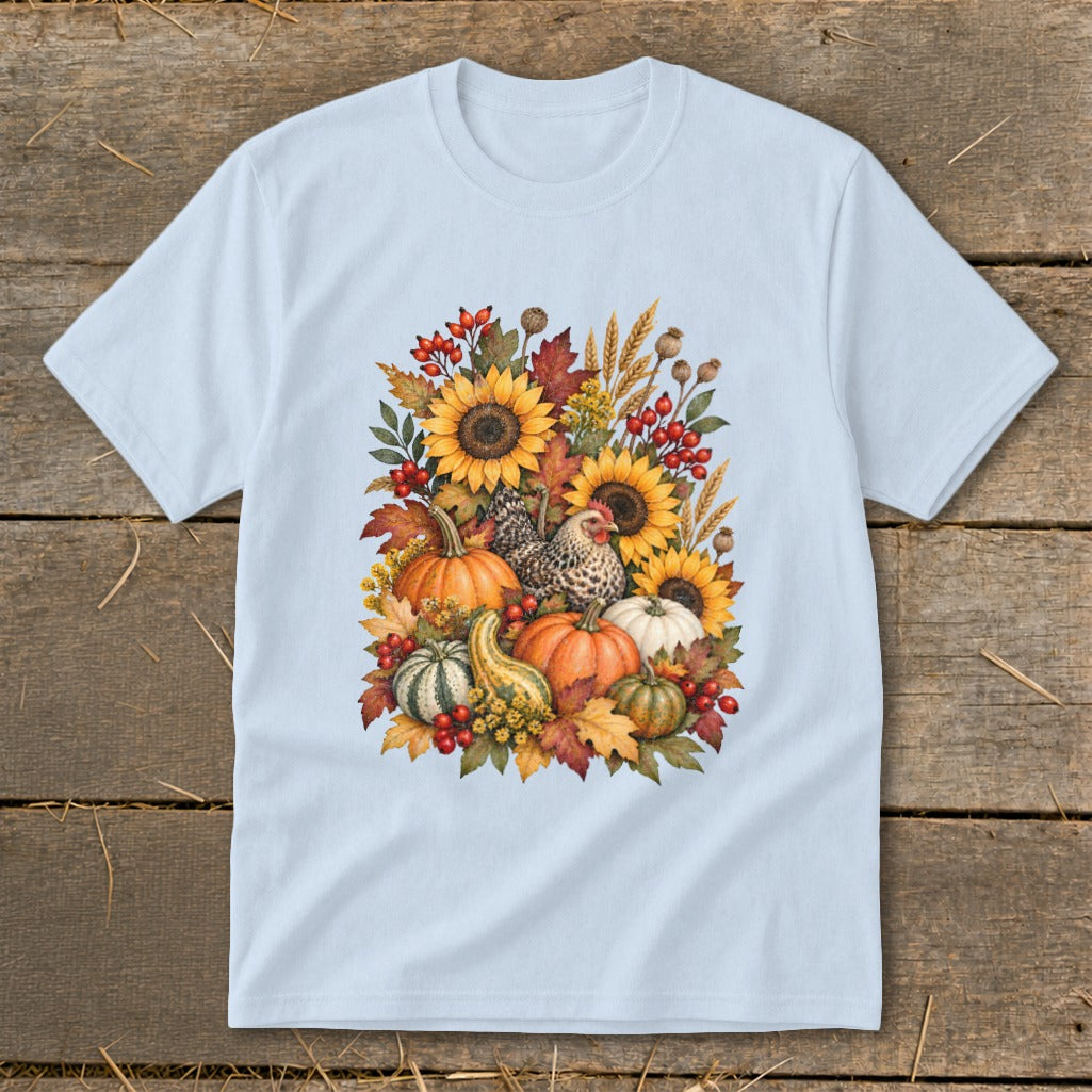 Light blue t-shirt with watercolor autumn harvest design featuring pumpkins, sunflowers, and chickens.